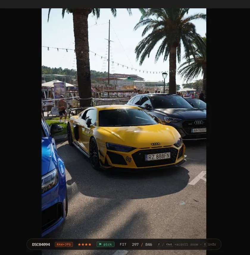 Cullora's full-screen viewer on frame 297 of 846, a yellow Audi R8, rated four stars and flagged as a pick, with the RAW+JPG badge showing both files travel together.